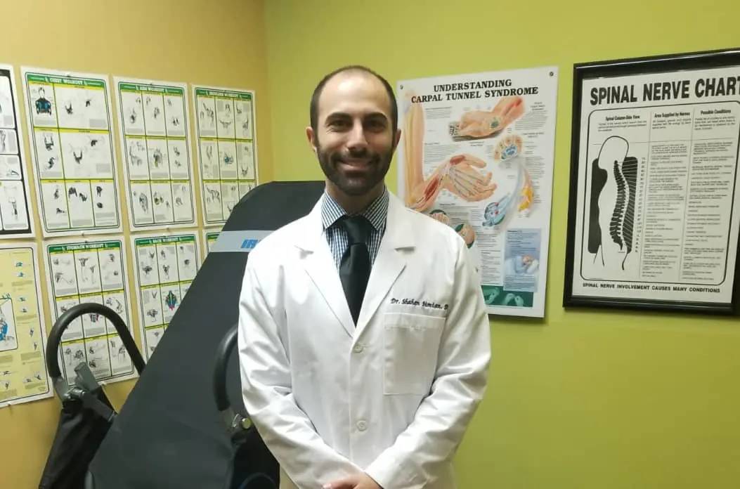 Burbank Chiropractor in Office answering frequently asked questions about chiropractic