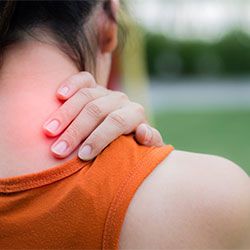 female athlete experiencing neck pain