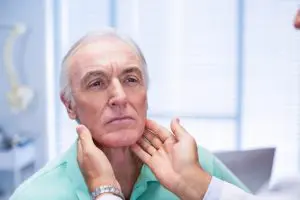 elderly man getting examined by chiropractor 