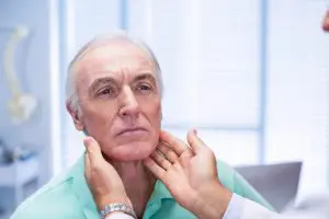 elderly man getting examined by chiropractor and doing Whiplash Treatment in Burbank