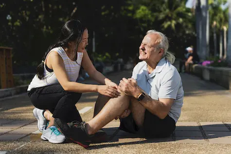 Old man having a knee pain