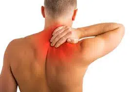 Man holding his upper back due to pain