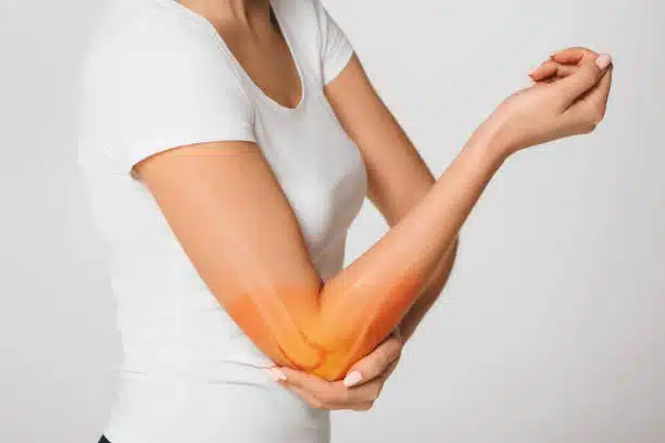 woman suffering pain in the elbow.