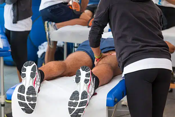 Athlete undergoing sports massage before the marathon.