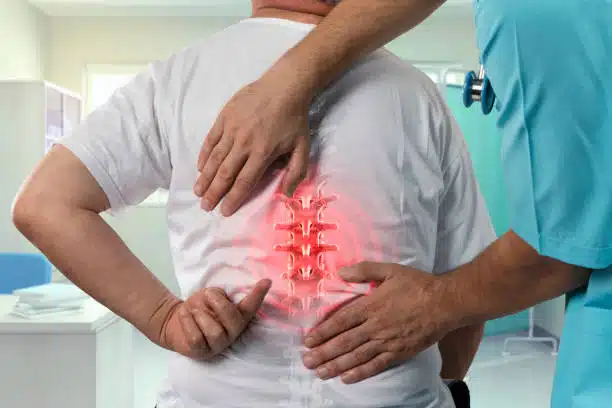 Chiropractor helping a patient while having a chiropractic evaluation.