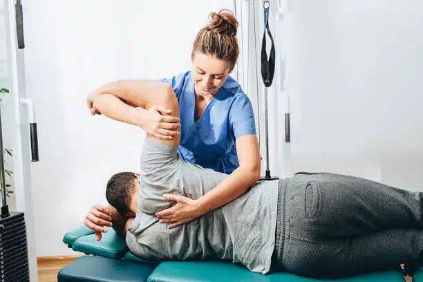 Chiropractor doing some chiropractic adjustment to the patient.