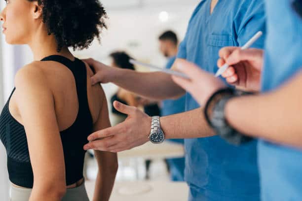 Chiropractor doing some chiropractic evaluation to the patient.