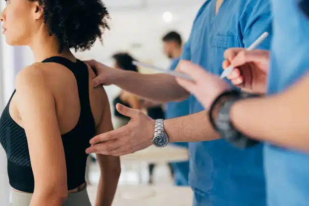 Chiropractor doing some chiropractic evaluation to the patient.