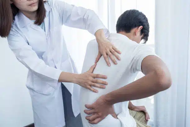 Chiropractor doing some chiropractic evaluation to the patient.