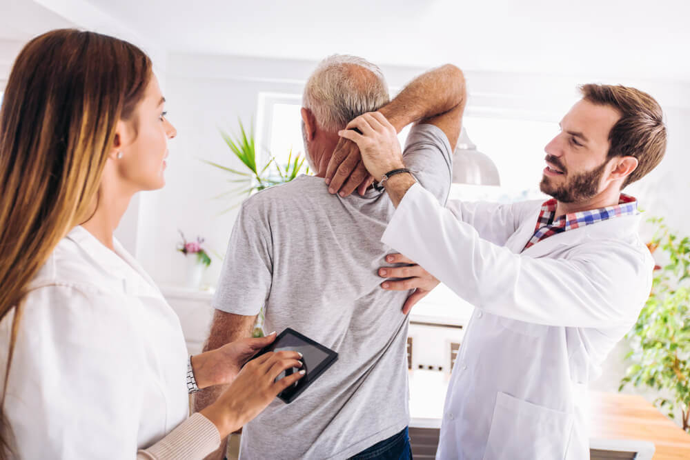 Chiropractor doing some chiropractic evaluation to the patient 