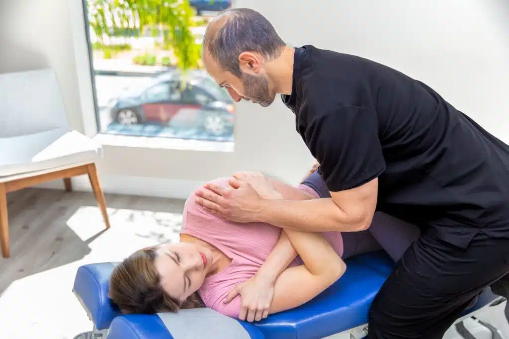 Dr. Simian performing chiropractic care treatmentfor personal injury  at Burbank Clinic.