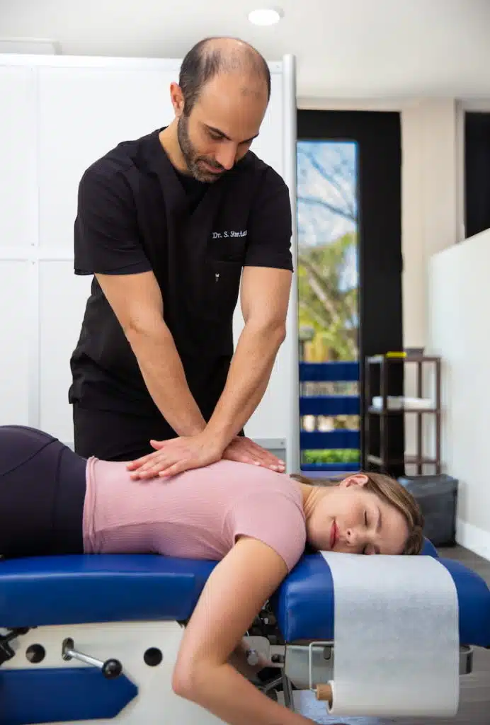 Dr Simian experienced chiropractor treating patient for spinal decompression therapy