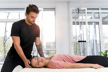 chiropractor treating patient using Active Release Technique