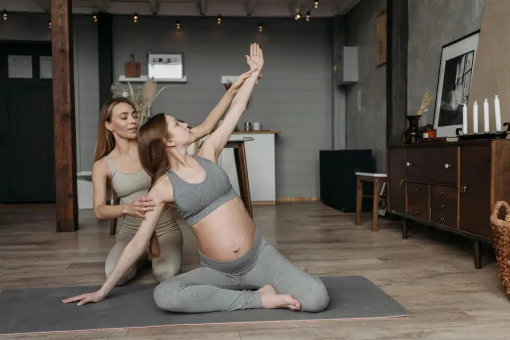 Pregnant Woman Sitting on Yoga Mat