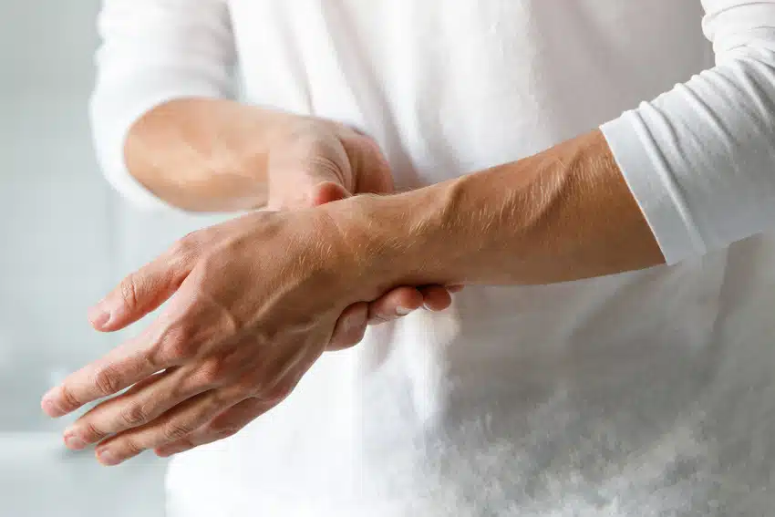 closeup-of-man-arms-holding-painful-wrist